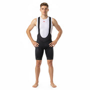 White mesh sleeveless cycling base layer worn under black bib shorts