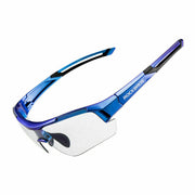 Blue photochromic cycling sunglasses with a frameless design and clear lenses, featuring a blue and purple color scheme with a logo on the side.